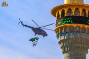 Photos: Aerial scenes of raising mourning flag of martyrdom of Imam Al-Kadhim over sky of Kadhimiya Shrine