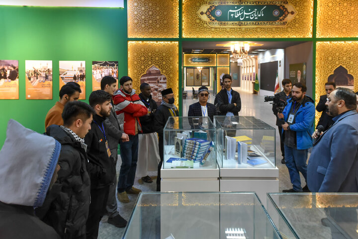 Photos: Participants of 41st Intl. Quran Competition visit Service Portico exhibition in Imam Reza shrine