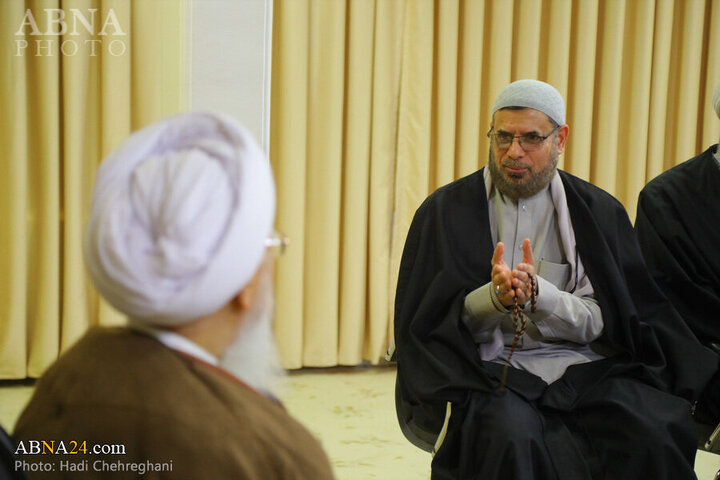 Photos: Flag of Imam Hussain shrine presented to Grand Ayatollah Javadi Amoli