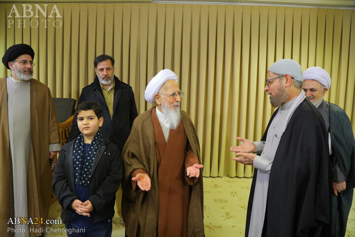 Photos: Flag of Imam Hussain shrine presented to Grand Ayatollah Javadi Amoli