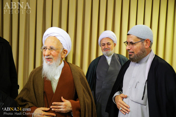 Photos: Flag of Imam Hussain shrine presented to Grand Ayatollah Javadi Amoli