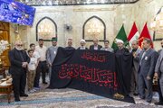 Al-Abbas holy shrine receives banner of mourning for Imam as-Sadeq from Kadhimiyah shrine