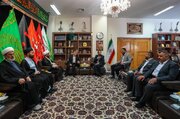 تقرير مصور / وفد العتبة العلويّة المقدّسة يقدّم راية المولى أمير المؤمنين (ع) إلى خدم العتبة الرضويّة المقدّسة