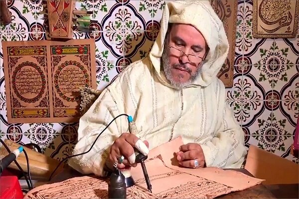 Moroccan calligrapher creates Quran manuscript on goatskin despite lifelong disability