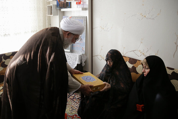 Photos: Custodian of Astan Quds Razavi meets with martyrs families