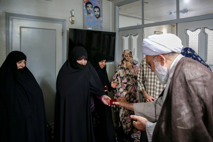 Photos: Custodian of Astan Quds Razavi meets with martyrs families