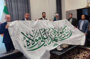 وفد العتبة العلويّة المقدّسة يسلّم راية الغدير الأغرّ إلى العتبة الرضوية المقدسة + صور