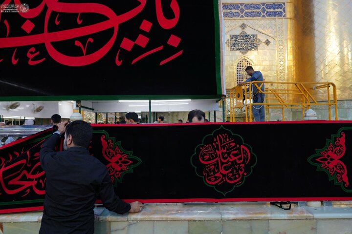 Photos: Imam Ali holy shrine covered in black on eve of Muharram
