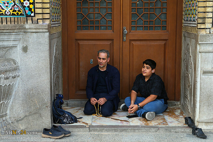 Photos: Changing flag of Hazrat Masoumeh shrine's dome ahead of Muharram
