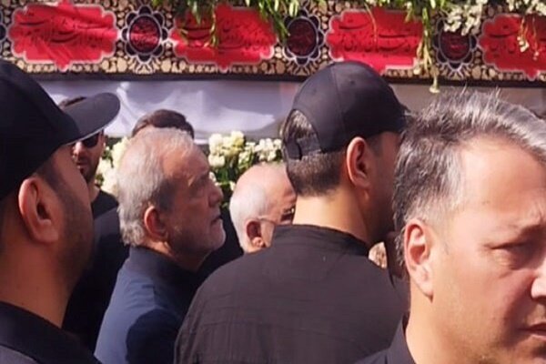 Iran President takes part at funeral for martyrs