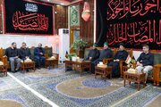 Delegation of Al-Abbas Shrine hands over banner of Imam al-Hassan to Imam Ali Shrine