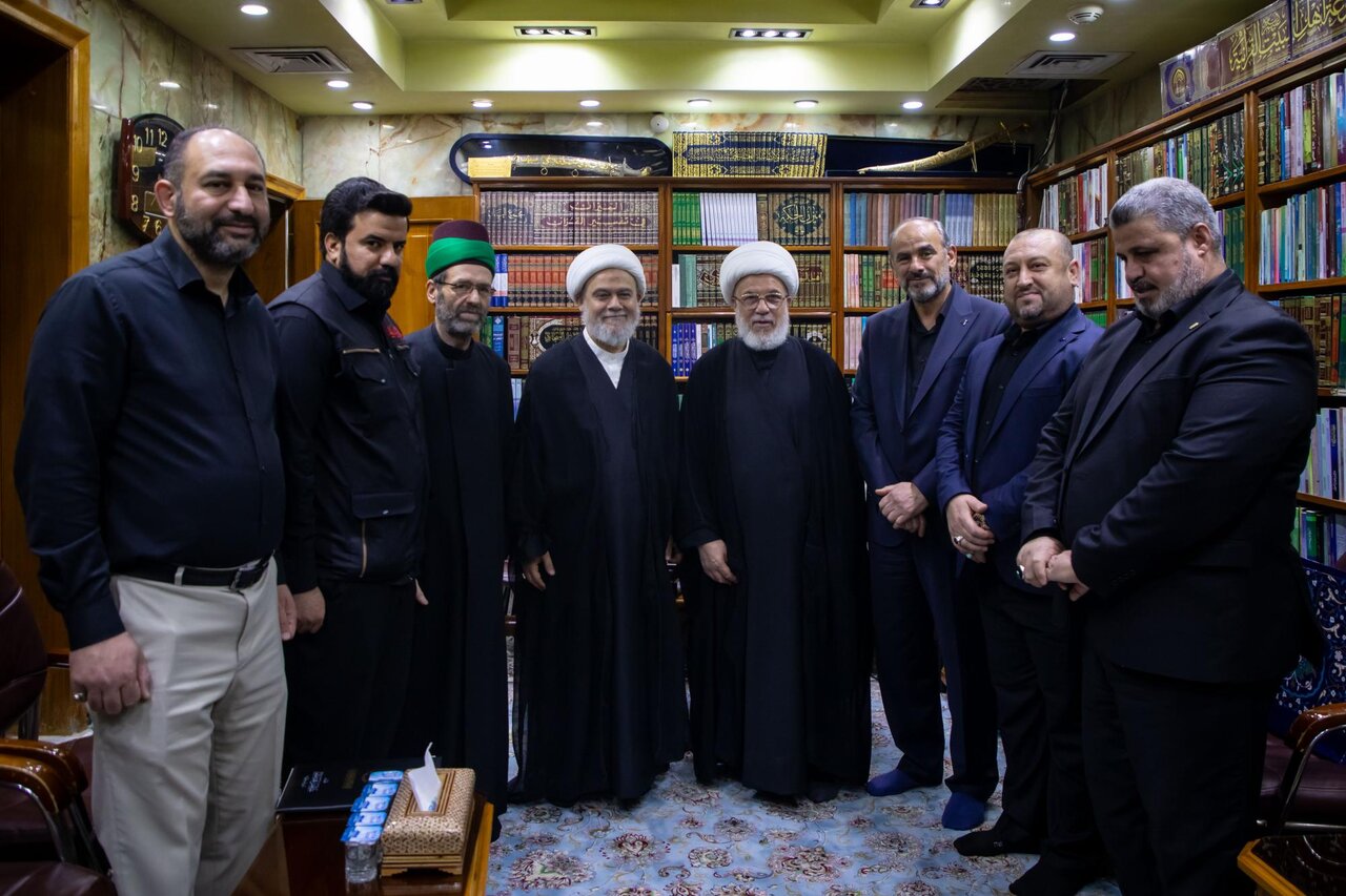 Al-Abbas Holy Shrine hands over banner of Imam al-Hassan to Imam al-Hussain Holy Shrine