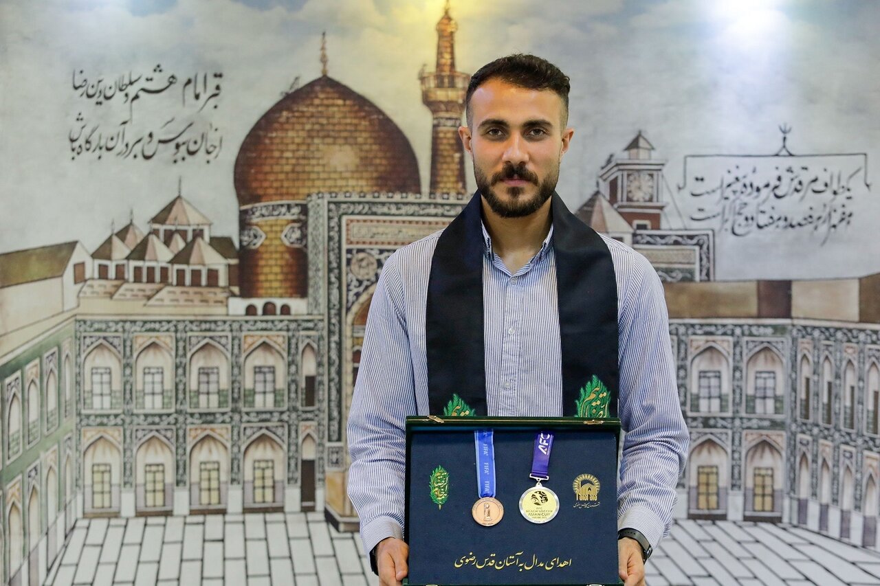 Iranian beach soccer star donates medals to Imam Reza Shrine museum