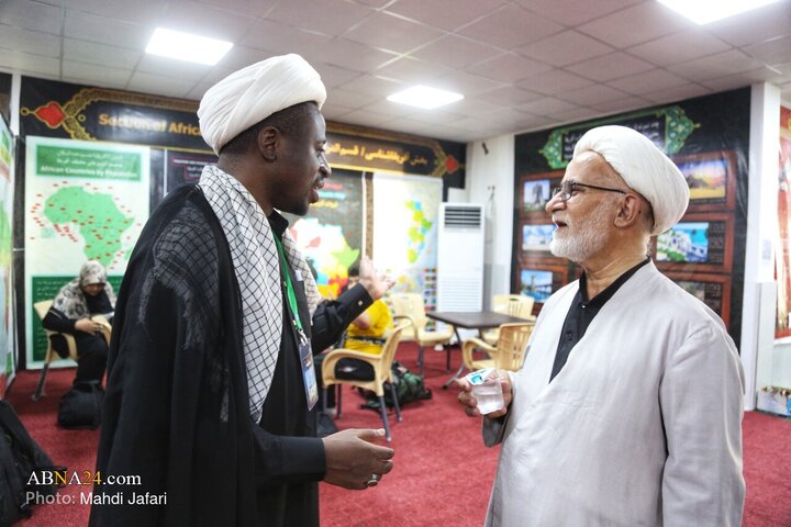 تقرير مصور/ عبير القارة السمراء في درب العشق؛ موكب عشّاق الحسين (ع) يستقبل زوّار الأربعين عند العمود ٣٧٩