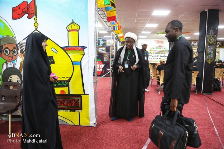 تقرير مصور/ عبير القارة السمراء في درب العشق؛ موكب عشّاق الحسين (ع) يستقبل زوّار الأربعين عند العمود ٣٧٩