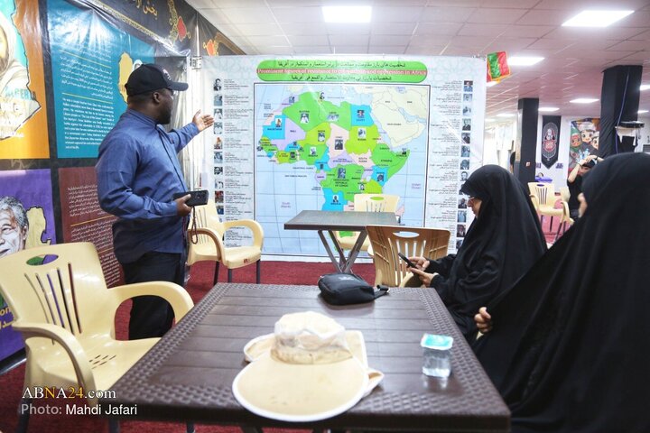 تقرير مصور/ عبير القارة السمراء في درب العشق؛ موكب عشّاق الحسين (ع) يستقبل زوّار الأربعين عند العمود ٣٧٩