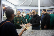 Photos: IRGC commander, Mayor of Qom serve Hazrat Masoueh pilgrims