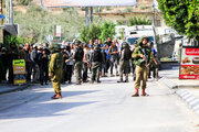 Colonists, backed by Israeli soldiers, storm Ramallah-area village