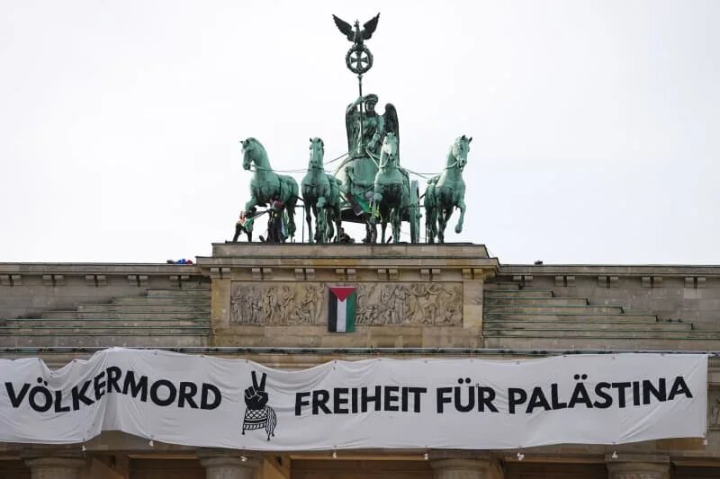 Huge Pro-Palestinian Banner Hung from Brandenburg Gate in Berlin Protest