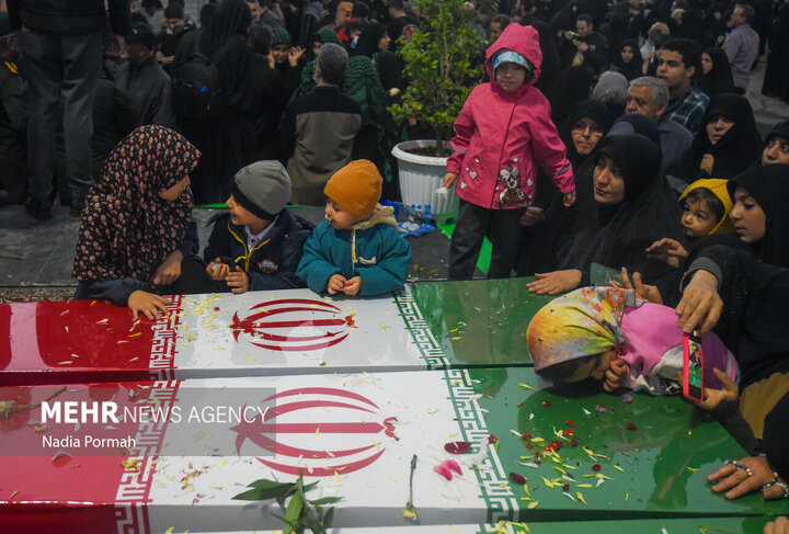Photos: Funeral of 10 unidentified martyrs in Iran's Karaj
