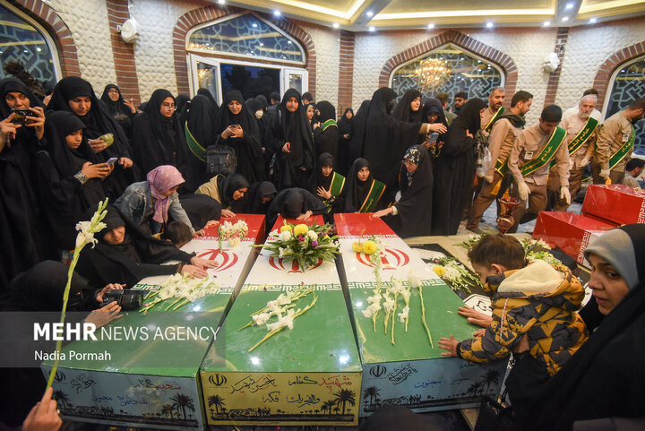 Photos: Funeral of 10 unidentified martyrs in Iran's Karaj