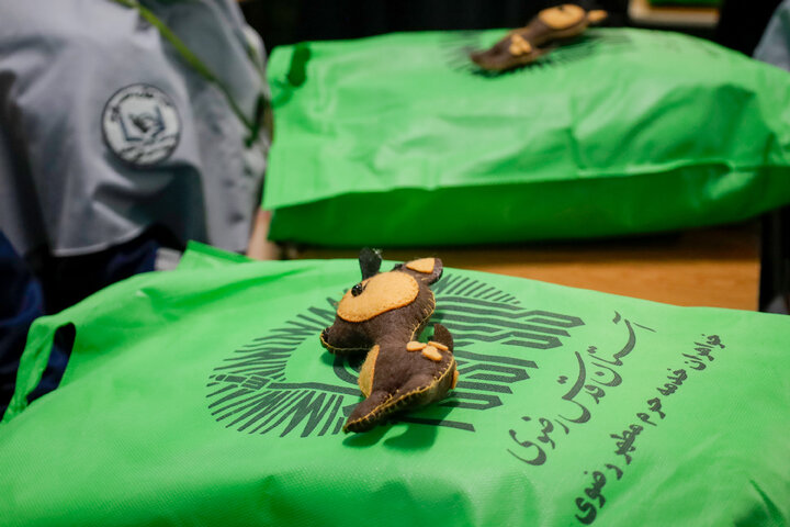 Photos: Distribution of jackets, cultural items by servants of Imam Reza holy shrine