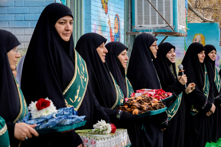 Photos: Distribution of jackets, cultural items by servants of Imam Reza holy shrine