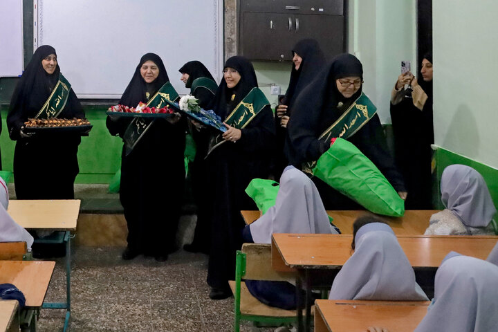 Photos: Distribution of jackets, cultural items by servants of Imam Reza holy shrine