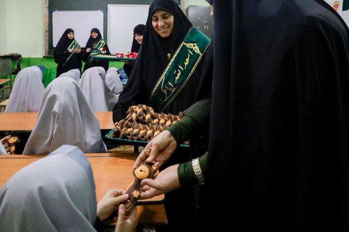 Photos: Distribution of jackets, cultural items by servants of Imam Reza holy shrine