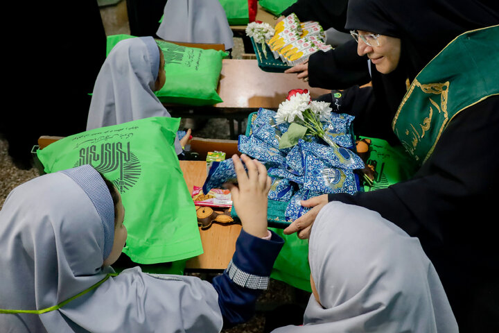 Photos: Distribution of jackets, cultural items by servants of Imam Reza holy shrine