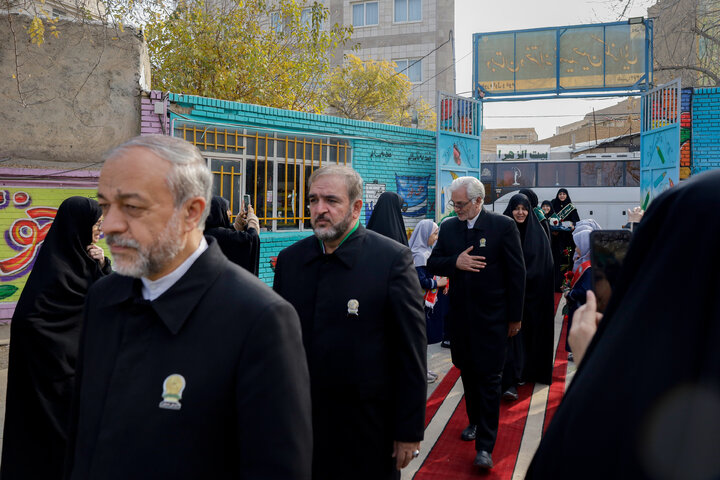 Photos: Distribution of jackets, cultural items by servants of Imam Reza holy shrine