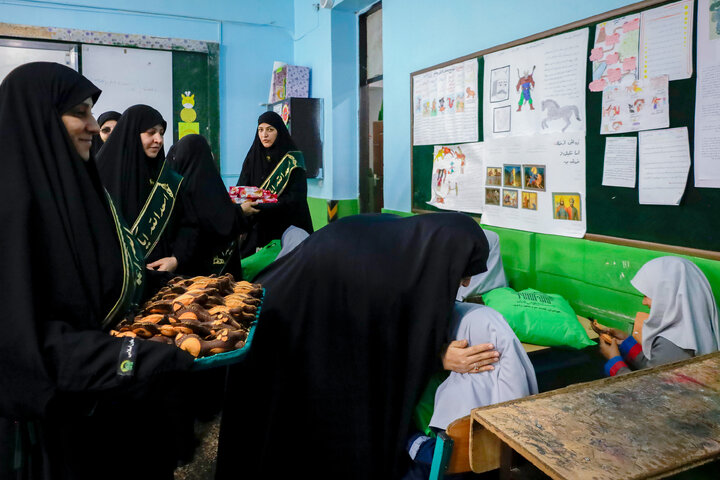 Photos: Distribution of jackets, cultural items by servants of Imam Reza holy shrine