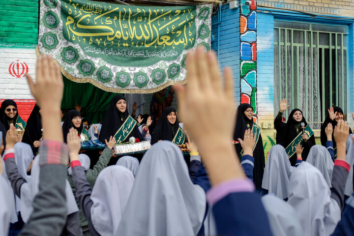 Photos: Distribution of jackets, cultural items by servants of Imam Reza holy shrine