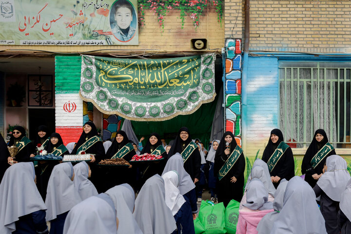 Photos: Distribution of jackets, cultural items by servants of Imam Reza holy shrine