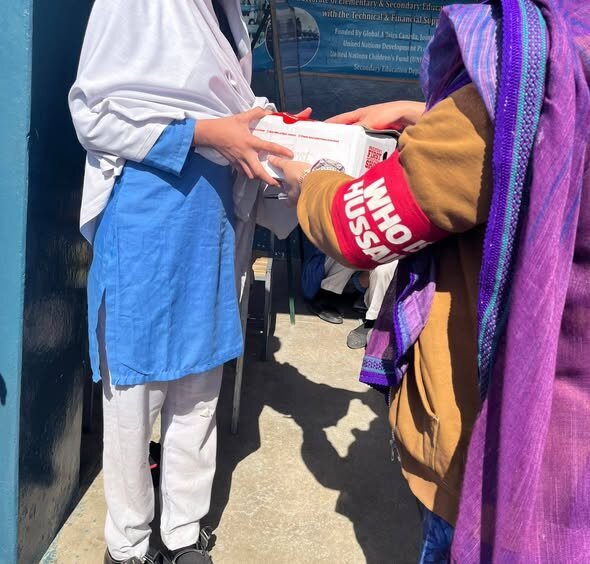 "Who is Hussain" Distributes Shoes to Underprivileged Students in Pakistan + Photos