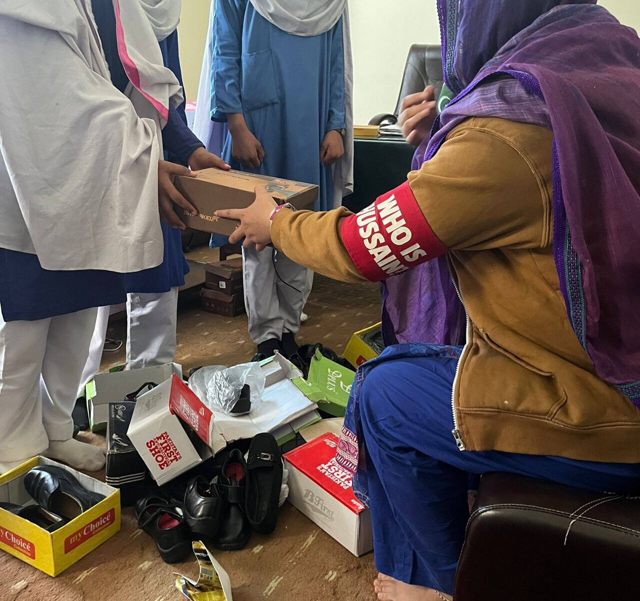 "Who is Hussain" Distributes Shoes to Underprivileged Students in Pakistan + Photos