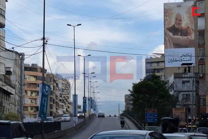 تقرير مصور/ نشر صور الحاج الشهيد قاسم سليماني في الضاحية الجنوبية لبيروت بمناسبة ذكرى سنويته
