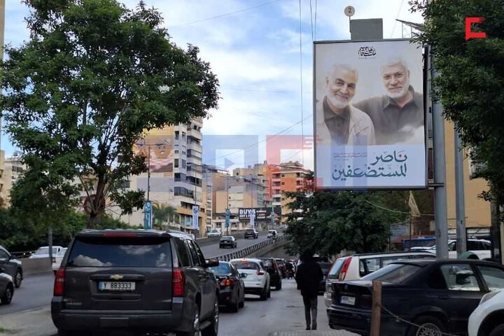 تقرير مصور/ نشر صور الحاج الشهيد قاسم سليماني في الضاحية الجنوبية لبيروت بمناسبة ذكرى سنويته