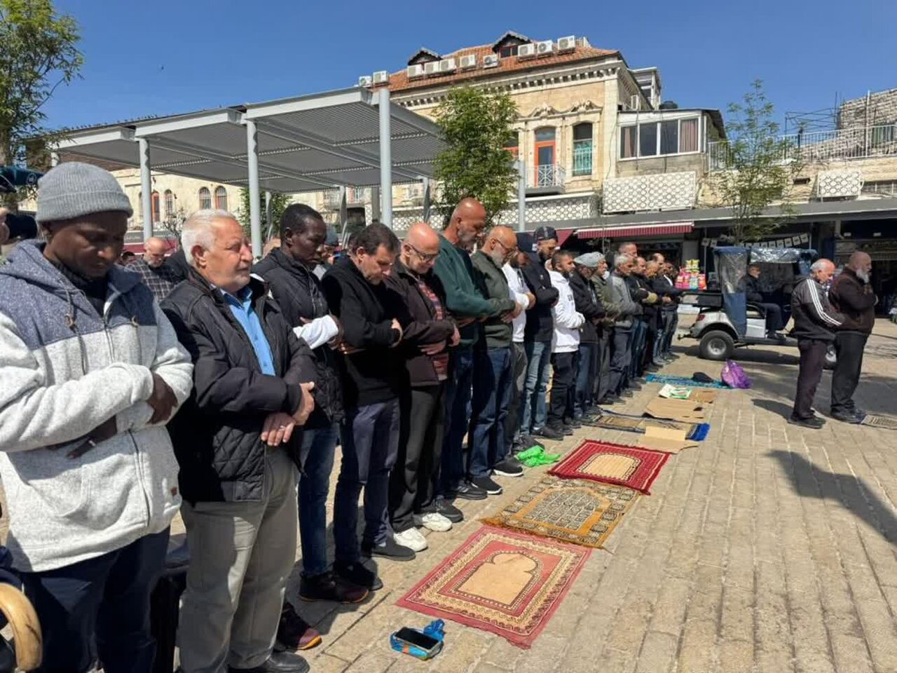 Palestinians perform Friday prayer near Damascus Gate