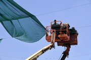 Maintenance department begins installing Saran fabrics around Al-Abbas holy shrine (+Photos)