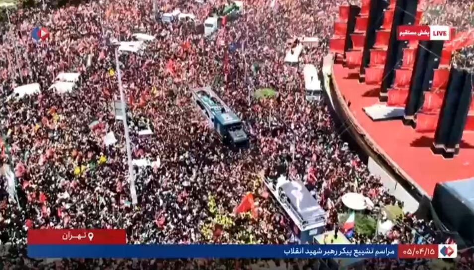 Video: A slow ceremonial circuit of martyr‑leader’s vehicle around Azadi Square as crowds surge in from all directions