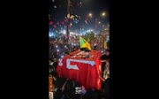 Video: Iraqis Shower Martyr Leader’s Body with Flowers