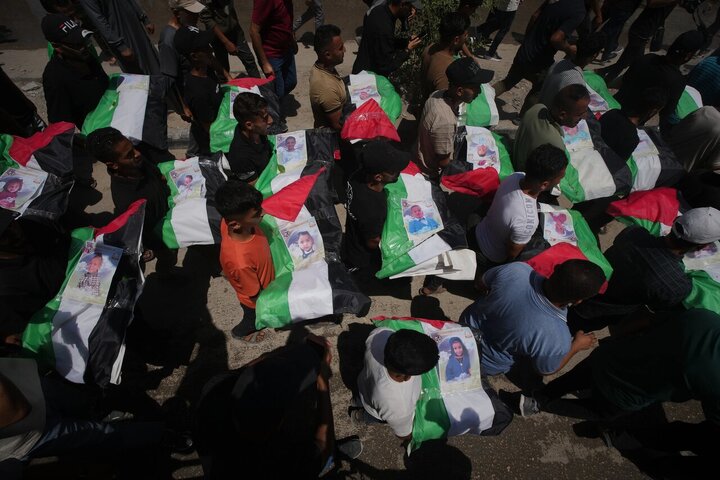 Photos: Mass Funeral for 112 Palestinians Held in Gaza