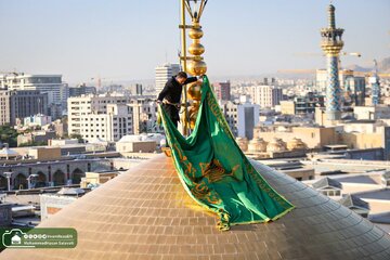 Photos: Holy Shrine of Imam Reza (AS) Replaces Black Flag with Green in Blessed Ceremony