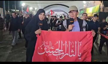 ABNA Reporters Ali and Zainab Explain Meaning of Red Flag "Ya Lisarat Al Hussain" on Najaf to Karbala Path
