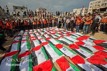 تقرير مصور/ تشييع 105 جثامين لفلسطينيين في مقبرة الشيخ "رضوان" في غزة