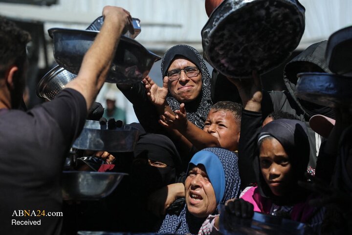 Photos: Palestinian Mother in Gaza Waits Six Hours for a Single Meal