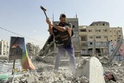Photos: Palestinians' collective effort to clear rubble in Gaza with primitive tools