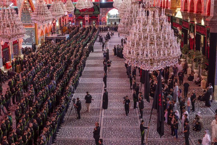 Through a unified funeral procession, staff of two holy shrines commemorate martyrdom of Lady Fatima az-Zahra