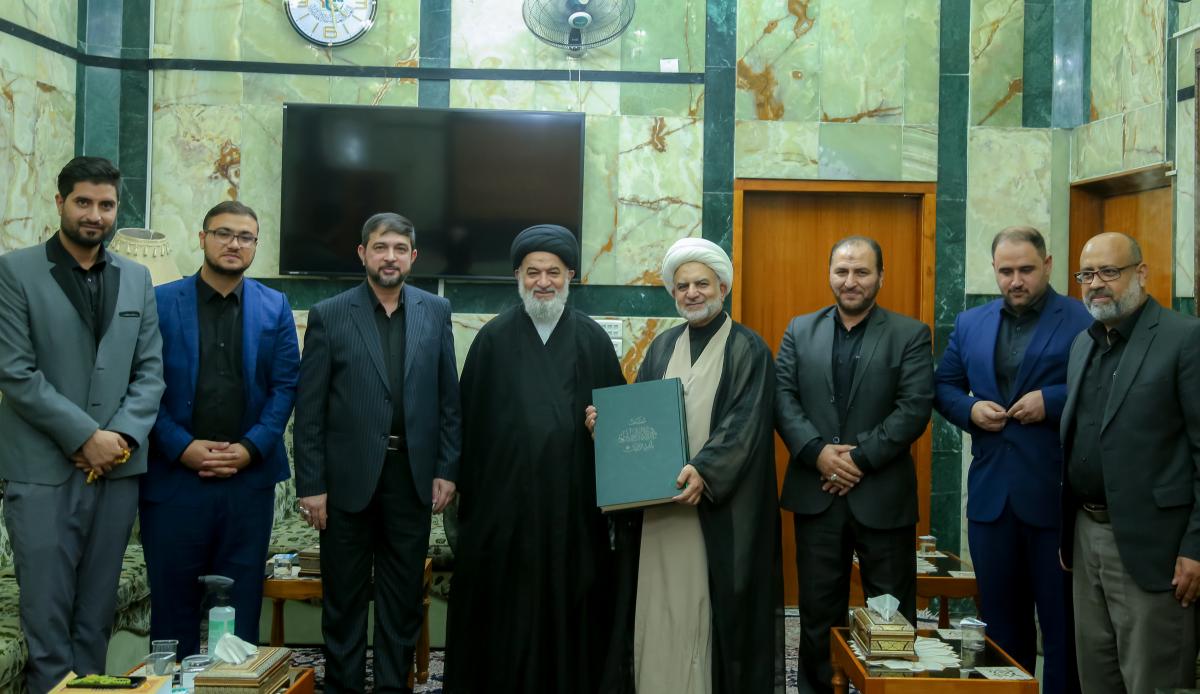 Senior official of Al-Abbas holy shrine receives final copy of Quran written by visitors during Arbaeen (+Photos)